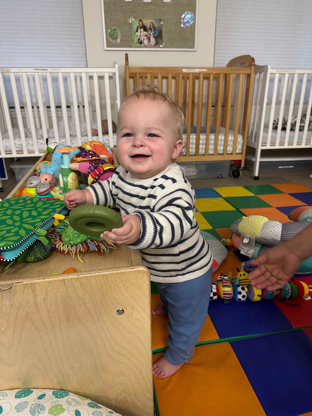A toddler exploring the classroom
